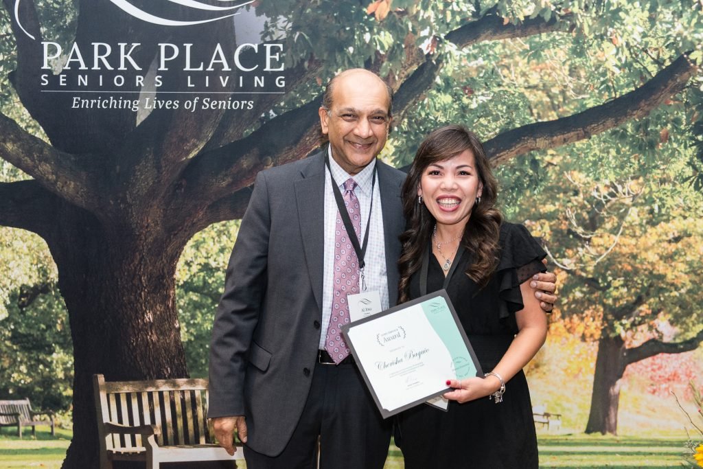 Cherisha receiving award at Park Place gala